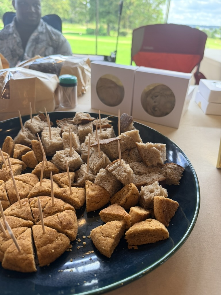 Bite-size bread and cookie samples ready to share at a neighborhood market