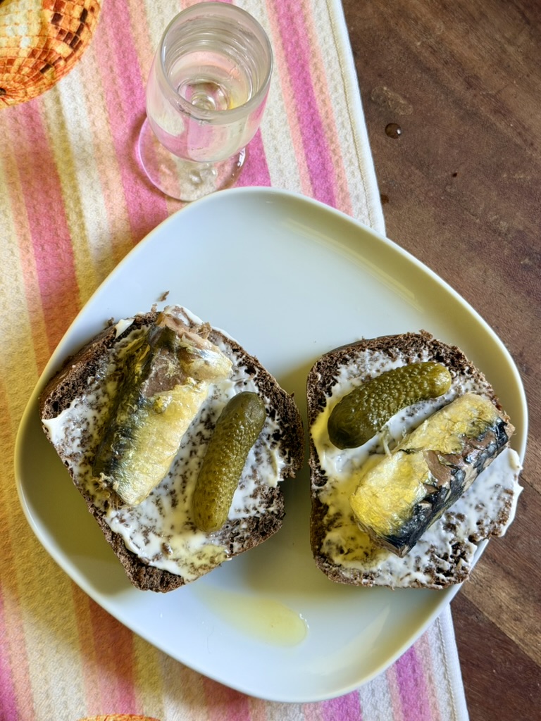 Open-faced rye sandwiches with sardines and pickles